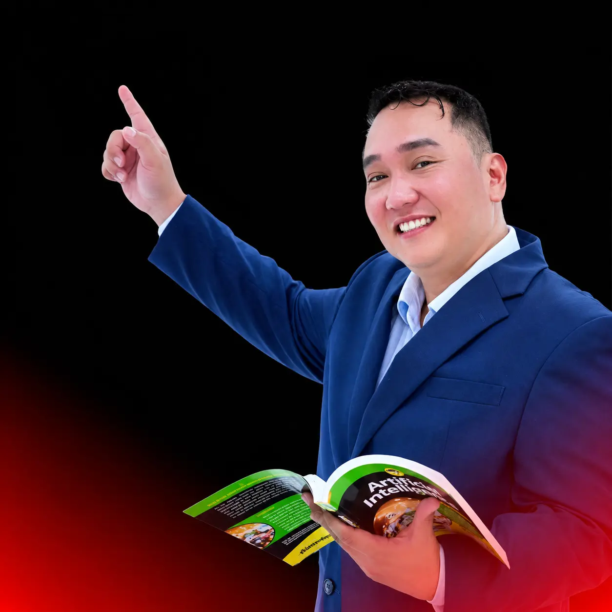 Alex G. Dugan, holding a book and pointing upward